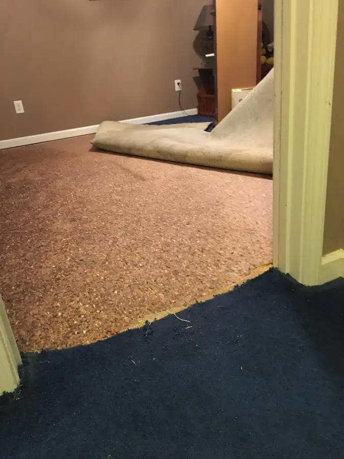 Carpet pad removal revealing water damage during Drying & Dehumidification in Corsicana